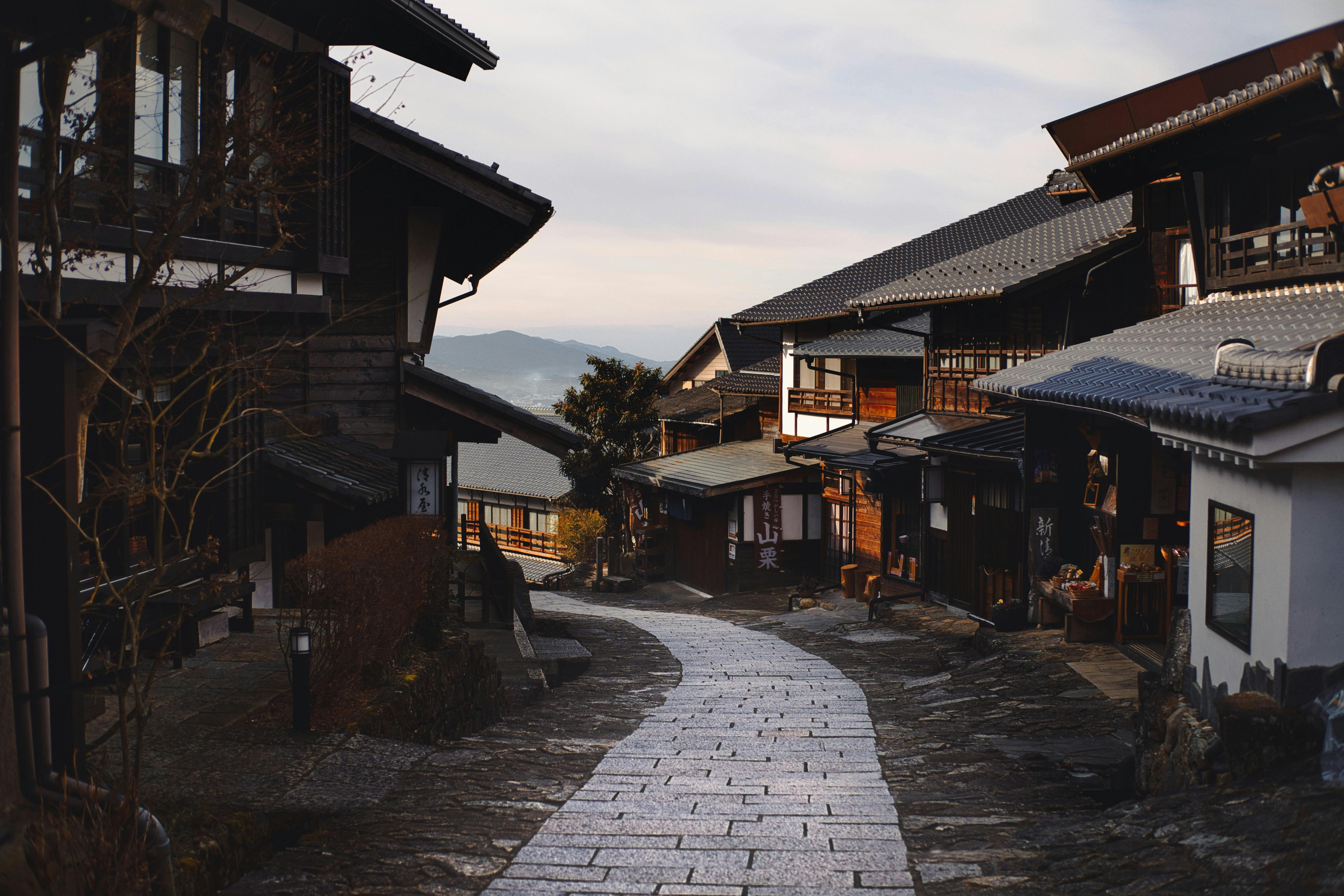 Quiet hillside town with winding stone path in Japan